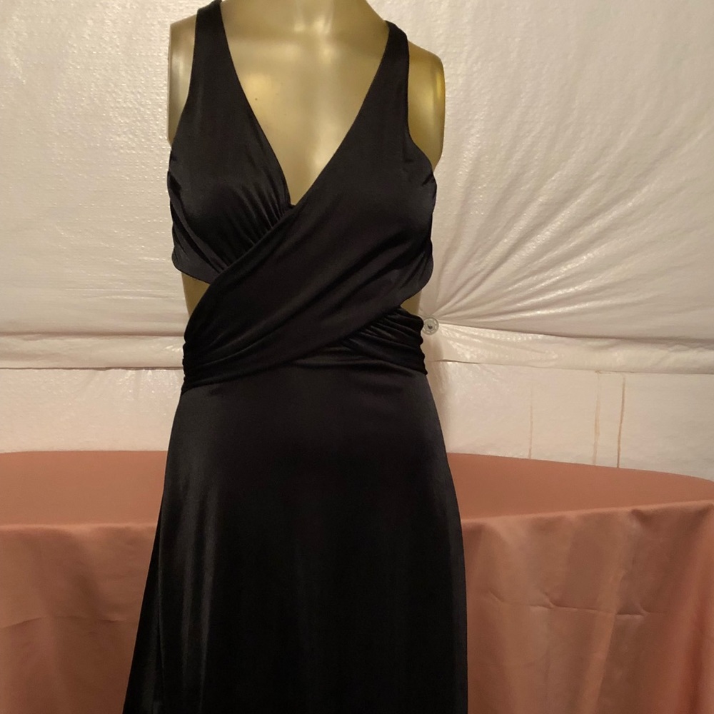 Just above the knee cut out black dress